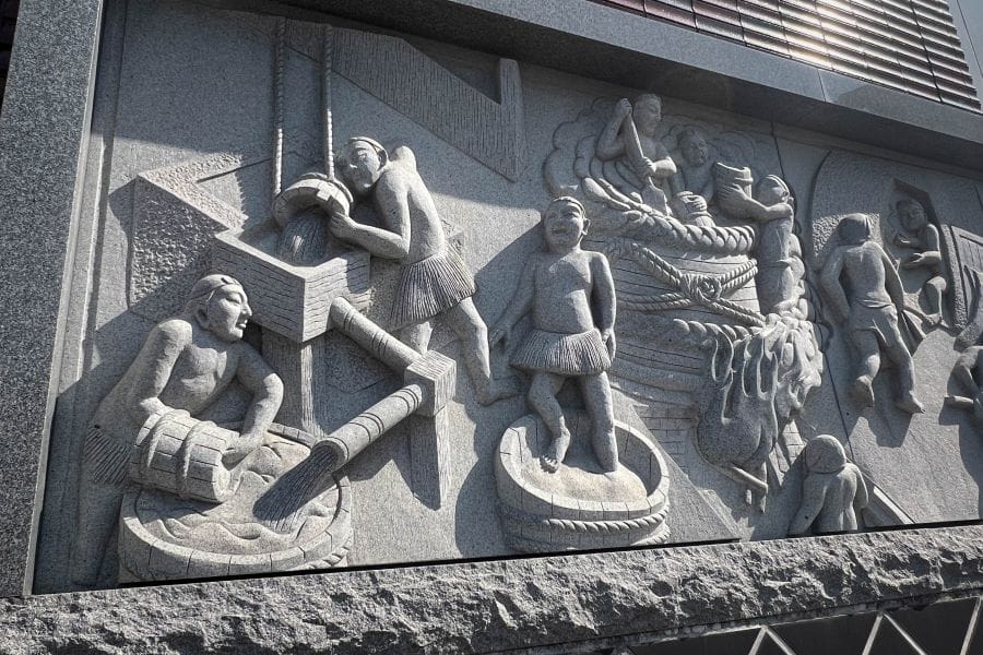 Saijo sake brewery district station relief frieze