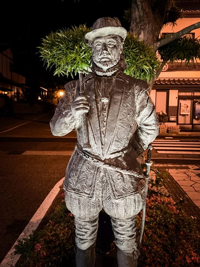 Will Adams bronze statue at night